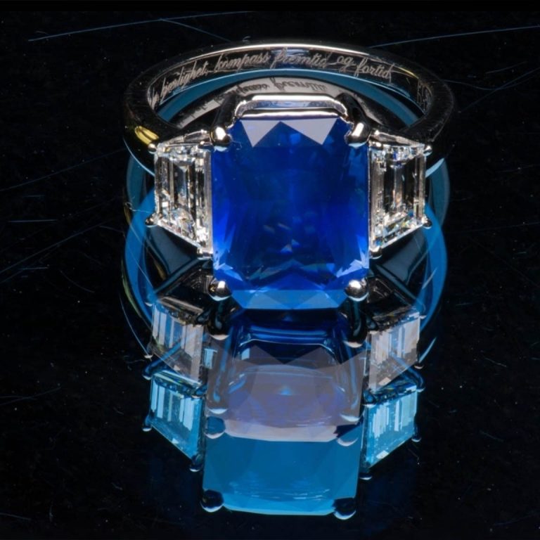 The Konnected Sapphire, a 7.2 carat intense cornflower blue Ceylon sapphire engagement ring with trapezoid diamonds in platinum