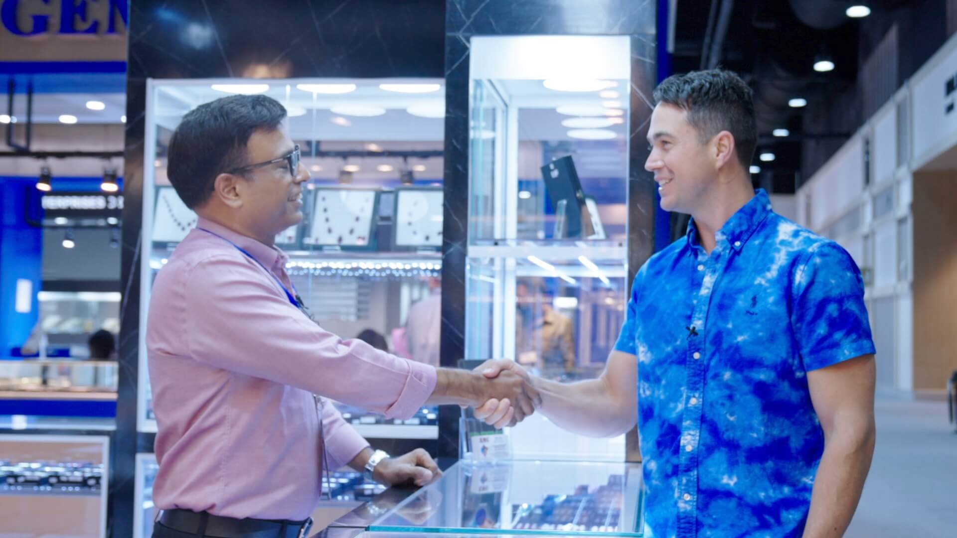 Josh shaking hands with the RMC team at the Bangkok Gem Show 2023
