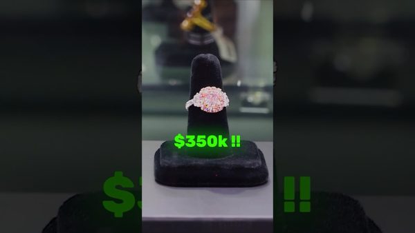 An Argyle pink diamond ring worth about $350,000 on a display stand, shown by RR Diamonds