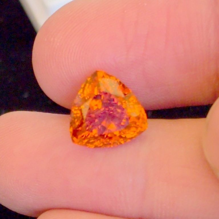 Close-up of the 7ct Fanta garnet showing the sparkle of its trillion cut