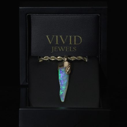 Squid Wisdom, Josh Mulrine's crystal opal belemnite from Coober Pedy in 18ct gold with a water droplet cap, his personal branding piece