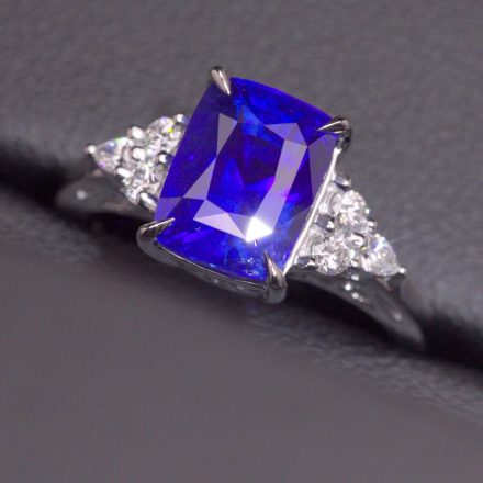 The Lewis Engagement Ring, a 5.6 carat vivid royal blue Ceylon sapphire with a trio of diamonds on each shoulder in 18ct white gold