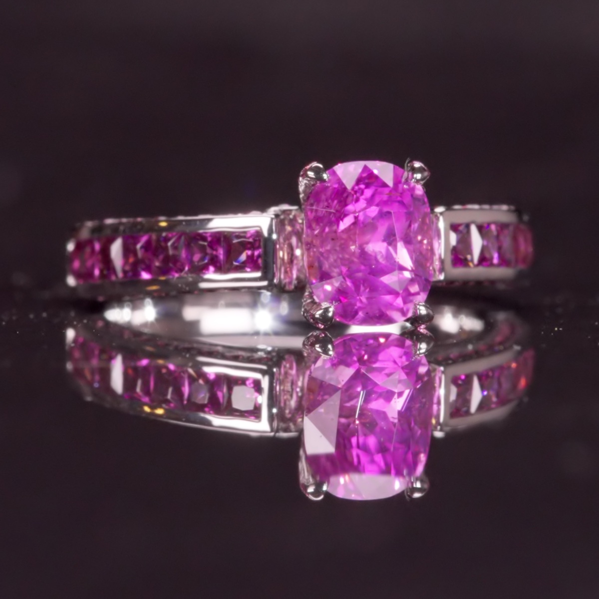 Princess Peach, a 2.12 carat unheated vivid purplish pink Ceylon sapphire ring with princess-cut and round amethysts in 18ct white gold